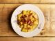 Nuove apertura a Roma marzo 2026. Un piatto della trattoria Da Adriana al Pigneto